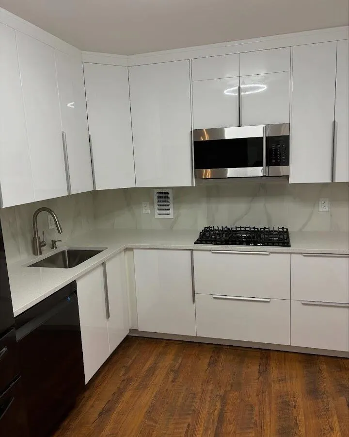 Restored kitchen with white cabinets after water damage in Long Beach
